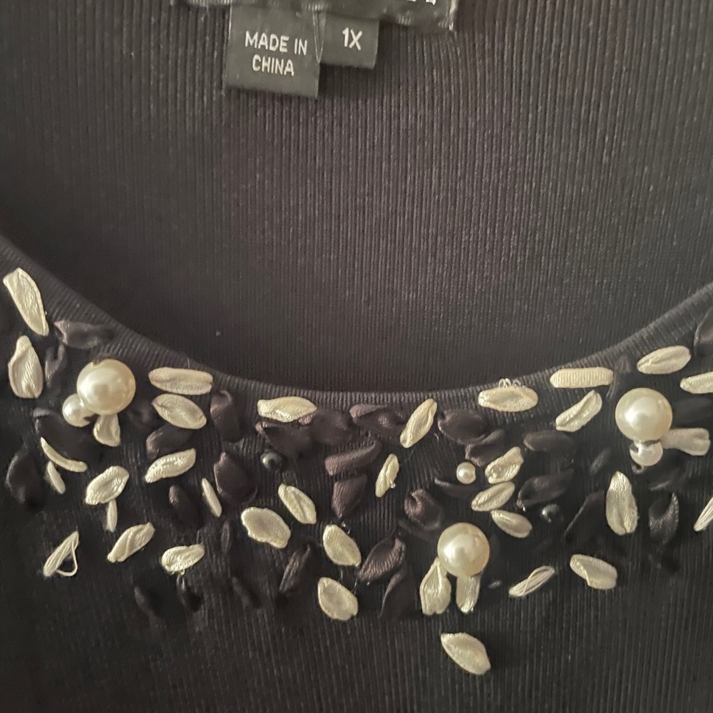 Black rayon/nylon sweater. 3/4 sleeve with ribbon and pearl detail.